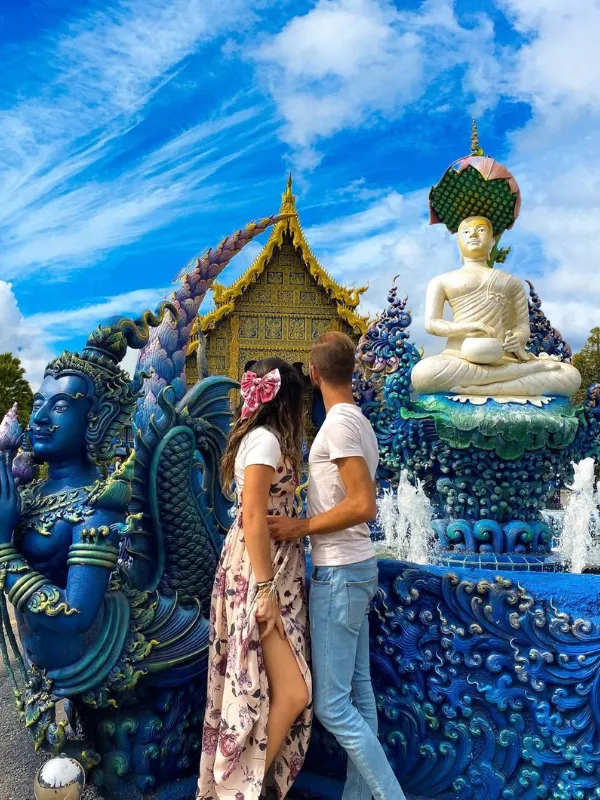 Couple admires Blue Temple’s sacred fountain art